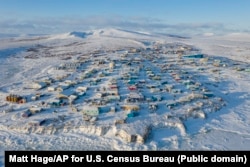 This high-angle photograph shows the Yup'ik city of Toksook Bay on Nelson Island in southeastern Alaska.