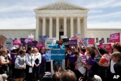 Democratic presidential candidate Sen. Amy Klobuchar, D-Minn., speaks during a protest against abortion bans, May 21, 2019, outside the Supreme Court in Washington.