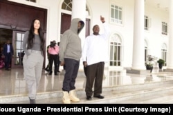 Kim Kardashian, Kanye West and Uganda President Yoweri Museveni chat outside State House Entebbe, Oct. 15, 2018.