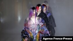 Models present creations by Japanese fashion designer Yuima Nakazato during the Spring-Summer 2022 Haute Couture collection fashion show in Paris, France.