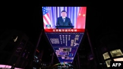 FILE —An outdoor screen in Beijing shows a news program about Chinese President Xi Jinping speaking on the sidelines of the Asia-Pacific Economic Cooperation Leaders’ week in California on November 16, 2023.