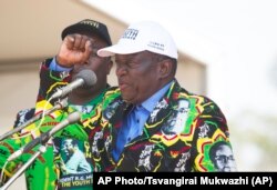 FILE - Emmerson Mnangagwa, then-vice president of Zimbabwe, greets party supporters in Gweru about 300 kilometres south west of the capital Harare, Sept, 1, 2017.