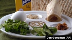 The Passover Seder plate, as shown in this March 8th, 2007 photo, is a special plate containing symbolic foods used by Jews during the Passover Seder. The items include (from top center): horseradish; a shank bone; a mixture of fruit, wine and nuts.