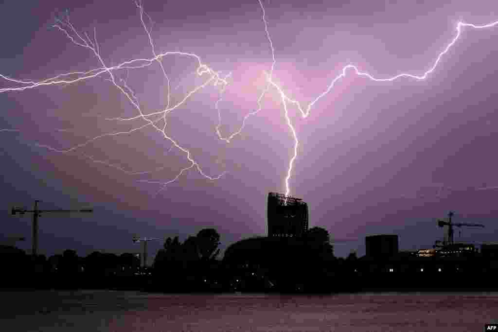 Flashes of lightning strike "La Cite du Vin" in Bordeaux, southwestern France, during a thunderstorm.