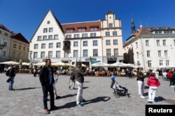 FILE - People gather in the Town Square in Tallinn, Estonia, May 31, 2018.