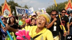 A supporter of the People's Alliance for Democracy (PAD) gestures during a rally outside the Government House in Bangkok, 25 Jan 2011