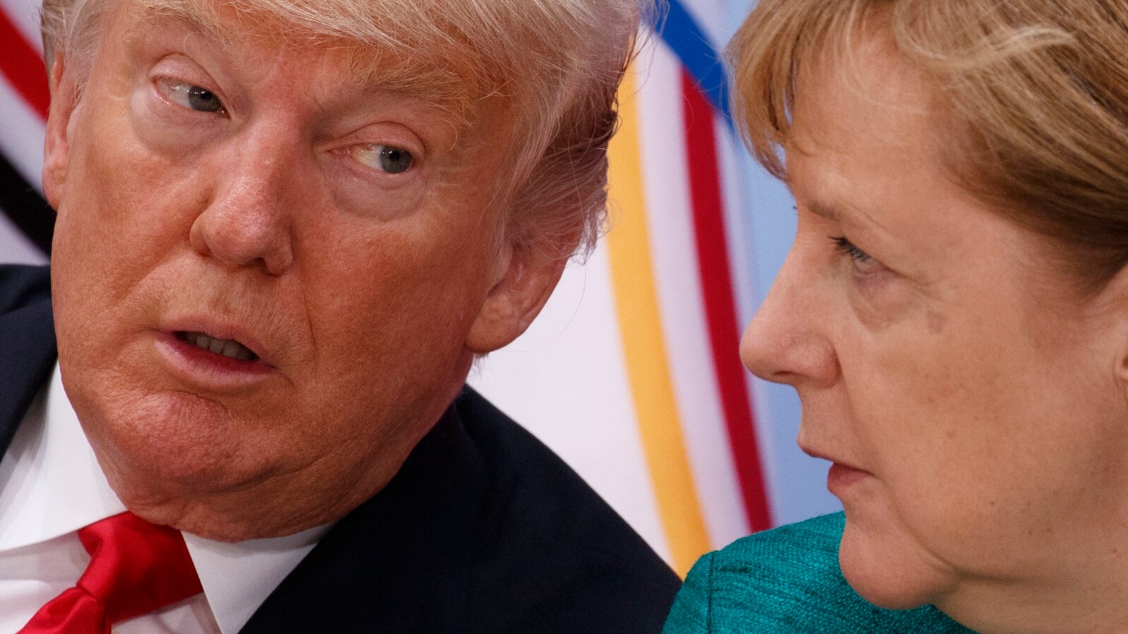 President Donald Trump, left, talks with German Chancellor Angela Merkel during the Women's Entrepreneurship Finance event at the G20 Summit, July 8, 2017.