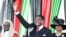 FILE - Malawi's newly elected President Lazarus Chakwera greets supporters after being sworn in in Lilongwe, Malawi, June 28, 2020.