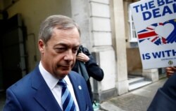 FILE - Britain's Brexit Party leader Nigel Farage leaves a TV studio in Westminster, London, Britain, Sept. 25, 2019.