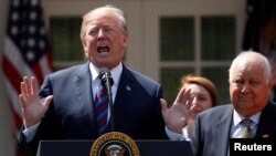 FILE - U.S. President Donald Trump gives remarks on tax cuts for American workers at the White House, Washinton, Apr. 12, 2018. 