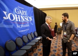 Libertarian presidential candidate Gary Johnson speaks to a delegate at the National Libertarian Party Convention, May 27, 2016, in Orlando, Florida.