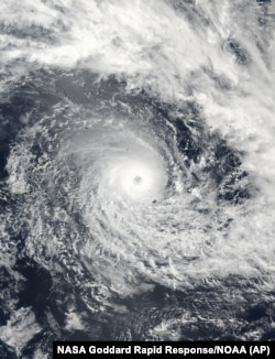 A satellite image released by NASA Goddard Rapid Response shows Cyclone Winston in the South Pacific Ocean, Feb. 19, 2016. The Pacific island nation of Fiji readied as a formidable cyclone with winds of 300 kph (186 miles) bore down.