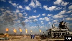 FILE - A picture taken on December 14, 2017 shows the Bin Omar natural gas facility, part of the Basra Gas Company, north of the southern Iraqi port of Basra.