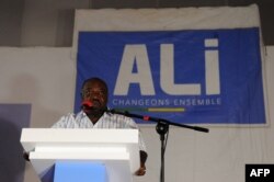 Gabon's incumbent president Ali Bongo Ondimba speaks to members of his campaign at election offices in Libreville, Aug. 28, 2016.