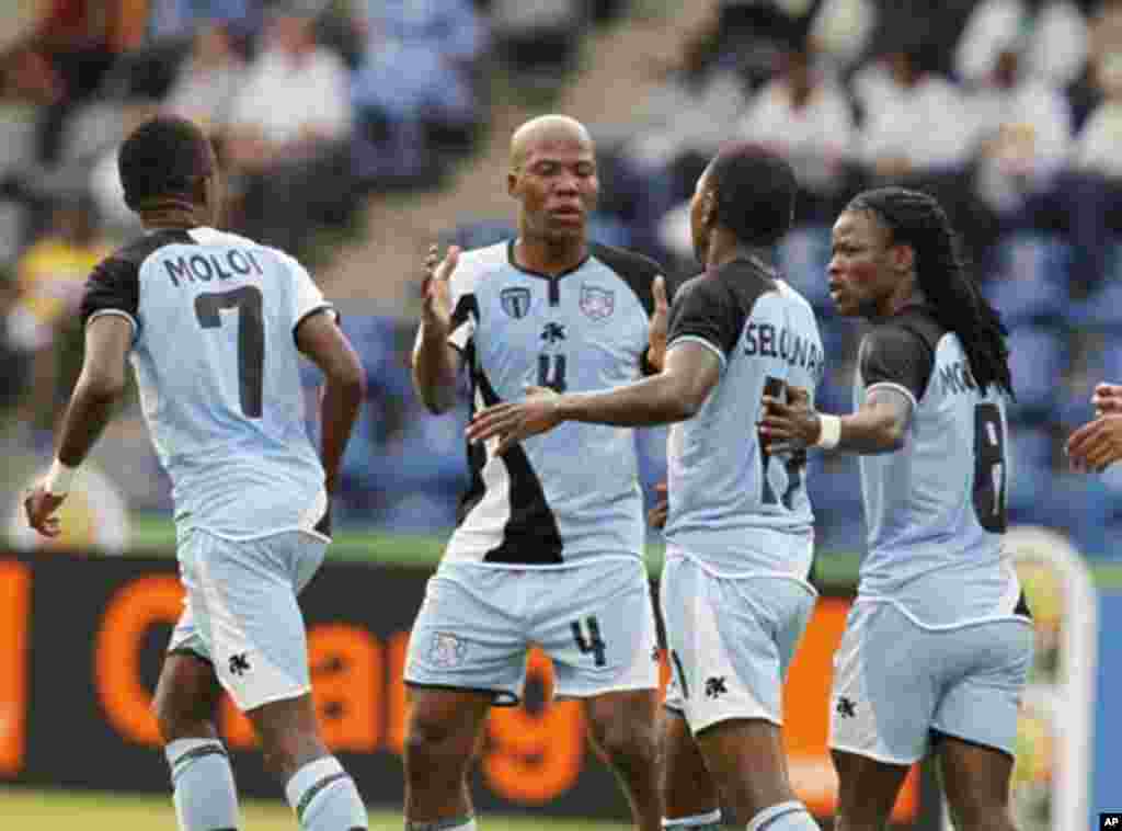 Botswana's Dipsy Selolwane (2nd R) celebrates his goal with teammates during their African Nations Cup Group D soccer match against Guinea at Franceville Stadium January 28, 2012.