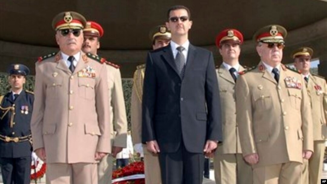 Syrian President Bashar Assad, center, General Hassan Turkmani, right, and General Ali Habib, chief of staff, left, tomb of the unknown martyr, near Damascus, Oct. 6, 2007.