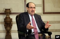 FILE - Nouri al-Maliki is seen in a Feb. 2, 2015, photo.