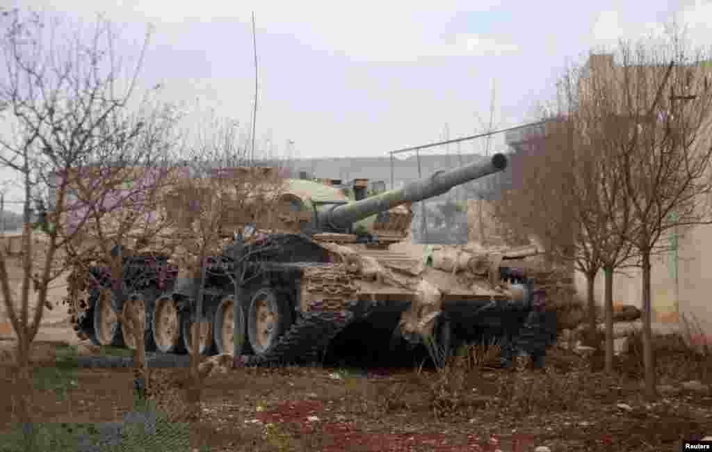 A Syrian Army soldier loyal to Syrian President Bashar al-Assad in a tank in Ard al-Hamra, Aleppo, Feb. 27, 2014.&nbsp;