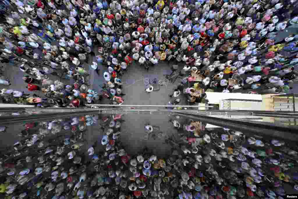 People are reflected on a building as they take part in a pro-EU demonstration in Iraklio on the island of Crete, Greece, July 2, 2015.