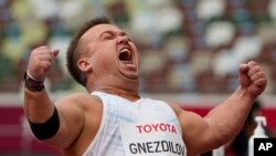 Denis Gnezdilov of the Russian Paralympic Committee reacts after winning the men's F40 shot put final during the 2020 Paralympics at the National Stadium in Tokyo, Aug. 29, 2021.