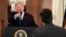 President Donald Trump points to CNN's Jim Acosta as he speaks during a news conference in the White House, in Washington, Nov. 7, 2018. 
