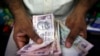 India Moves to Ease Currency Shortage in Rural Areas