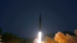 북한 조선중앙통신이 12일 공개한 전날 '극초음속 미사일' 시험 발사 장면.