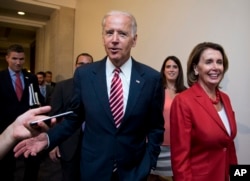 Vice President Joe Biden and House Minority Leader Nancy Pelosi of Calif., leave a meeting with the House Democratic Caucus about the Iran nuclear deal, July 15, 2015, on Capitol Hill in Washington.