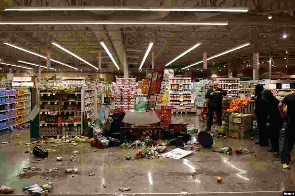 Fallen merchandises are seen inside a supermarket after it was looted by a small group of protesters during a largely peaceful march against a NY City grand jury decision in Berkeley, CA, Dec. 10, 2014.