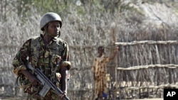 A Kenyan soldier stands guard an airstrip in an area near the Somali-Kenyan border where al-Shabab militants are active (file photo).