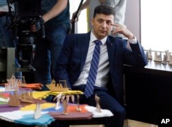 FILE - Ukrainian comedian Volodymyr Zelenskiy, who played the nation's president in a popular TV series, and is running for president in next month's election, is photographed on the set of a movie, in Kyiv, Feb. 6, 2019.