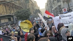 Women chant anti-military council slogans as they protest against the military council violations against female demonstrators in Cairo, Egypt, December 20, 2011.