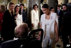 Rep. Alexandria Ocasio-Cortez, D-N.Y., arrives to hear President Donald Trump deliver his State of the Union address to a joint session of Congress on Capitol Hill in Washington, Tuesday, Feb. 5, 2019.