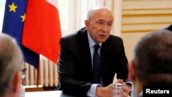 FILE - French Interior Minister Gerard Collomb, May 13, 2018. He is defended his handling of a video showing a top security aide to President Macron hitting a May Day protester.