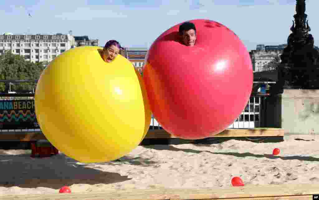 The married American couple Christina Gelsone and Seth Bloom participate in the clown-duo Acrobuffos as part of the Southbank Centre&rsquo;s Festival of Love, in London.