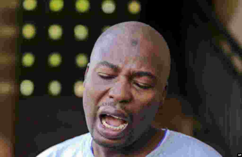 Nigerian Islamist sect member Ali Sanda Konduga reacts outside an Abuja magistrates court December 6, 2011. Konduga was sentenced on Tuesday to three years in prison for criminal intimidation, while charges against a senator who is accused of working with