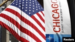 A banner is seen hanging in advance of the upcoming NATO meeting in Chicago, May 14, 2012. 