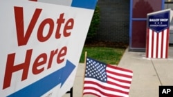 FILE - In this Oct. 20, 2020 file photo, a voting location is shown in Mission, Kan. A new survey by The Associated Press-NORC Center for Public Opinion Research and USAFacts finds that while voters say it’s pretty easy to find accurate information…