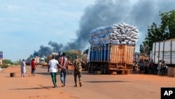 This video grab shows Malian security personnel detaining a man after Mali's army said a military training camp in the capital Bamako has been attacked early Sept. 17 2024.