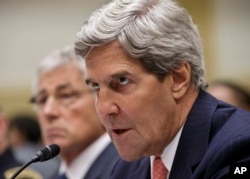 Secretary of State John Kerry, accompanied by Defense Secretary Chuck Hagel, left, testifies on Capitol Hill, Sept. 4, 2013, before the House Foreign Affairs Committee.