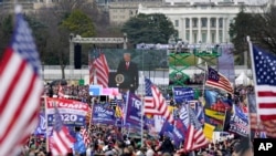 FILE - With the White House in the background, then-President Donald Trump addresses his supporters during a rally, in Washington, Jan. 6, 2021.