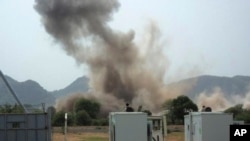 A hugh explosion near a United Nations compound in South Kordofan state, Tuesday, June 14, 2011