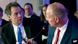 Gov. Steve Bullock of Montana speaks with Gov. Matt Mead of Wyoming during the National Governor Association 2018 winter meeting, Feb. 24, 2018, in Washington.