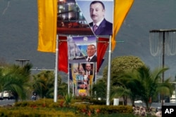 Billboards showing presidents of Azerbiajan, Kazakhstan and Turkey on a main highway to welcome them in Islamabad, Pakistan, Feb. 28, 2017.