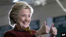 Democratic presidential candidate Hillary Clinton gestures at supporters during a campaign event at the Taylor Allderdice High School, Oct. 22, 2016, in Pittsburgh, Pennsylvania.