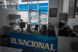 FILE - An employee works at a room of Venezuelan newspaper El Nacional in Caracas, Venezuela, June 14, 2019.