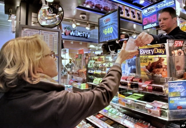 FILE - Age Diedrick, 68, purchases her lottery ticket in New York for a chance at the historic Mega Millions jackpot that reached more than $600 million on Friday, March 30, 2012. (AP Photo/Bebeto Matthews)