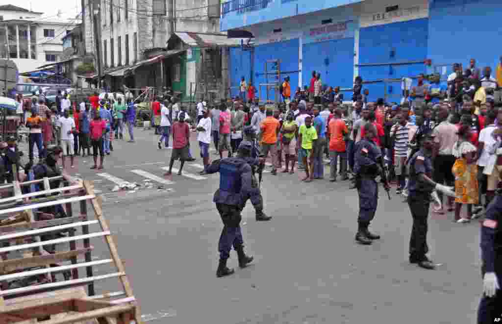 Liberia security forces blockade an area around the West Point Ebola center, Monrovia, Liberia, Aug. 20, 2014.