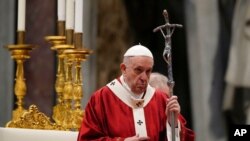 FILE - Pope Francis celebrates Mass in St. Peter's Basilica at the Vatican, June 29, 2021. The Vatican's criminal tribunal on July 3, 2021, indicted 10 people and four companies on charges including extortion.