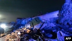 This photograph taken on June 24, 2021 shows damaged buildings in the village of Hrusky, 60 km south of Brno, South Moravia, Czech Republic, after it was hit by a tornado.